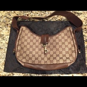 Pre-owned small Gucci handbag includes dust bag
